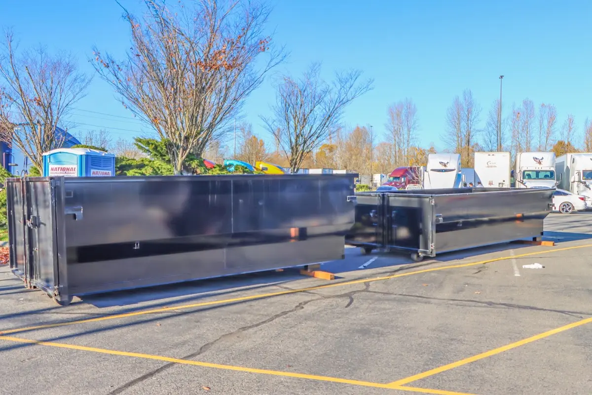 Professional dumpster rental service with roll-off container on residential driveway in Grover Beach